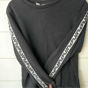 Woman’s FILA black sweatshirt with FILA down the arms. SIZE L cotton/ poly blend